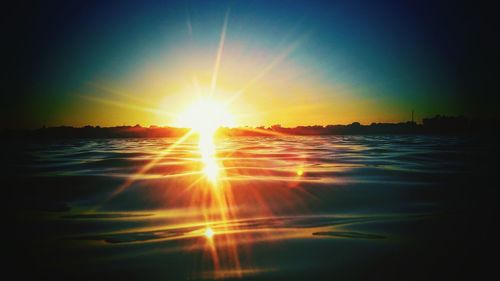 Sun shining over sea