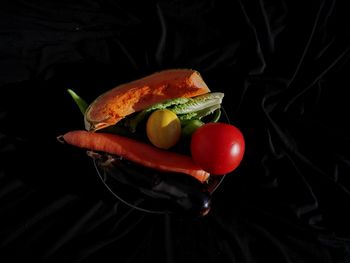 High angle view of fruits on black background