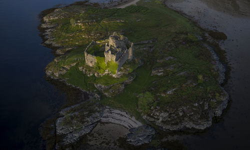 Aerial drone shot of castle tioram, it is a ruined castle in scotland