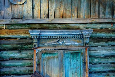 Old wooden door of abandoned building