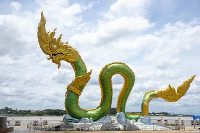 Low angle view of statue against sky