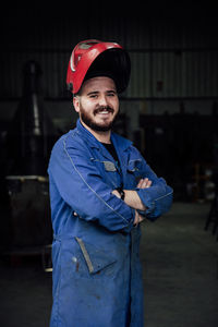 Portrait of smiling man standing outdoors