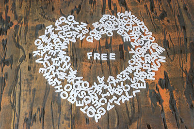 Close-up of heart shape alphabets on table 