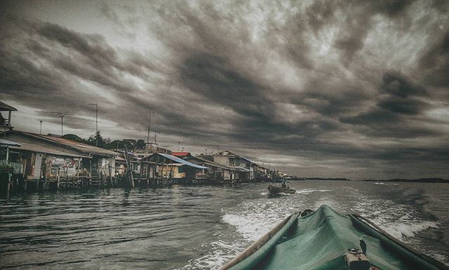 water, sky, cloud - sky, cloudy, nautical vessel, sea, transportation, built structure, boat, mode of transport, weather, architecture, building exterior, overcast, moored, cloud, waterfront, pier, nature, storm cloud