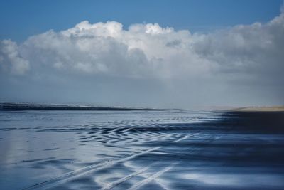 Scenic view of sea against sky during winter