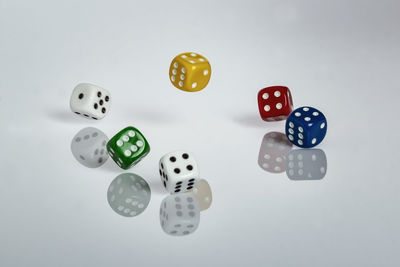 Close-up of coins over white background