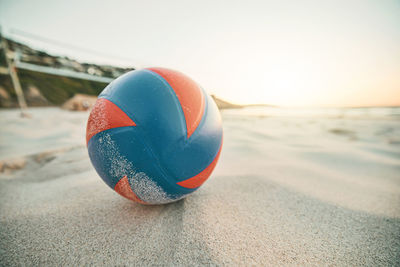 Close-up of globe on beach