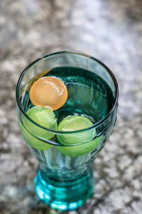 High angle view of ice cube in glass