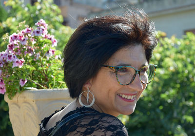 Close-up of smiling mature woman looking away