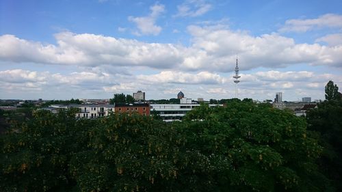 View of city against cloudy sky