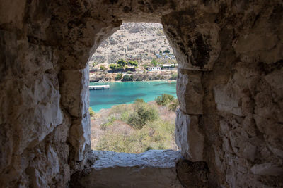 Scenic view of sea seen through cave