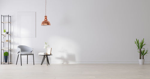 Empty chairs and tables against wall at home