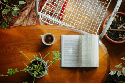 High angle view of a table with books and coffee