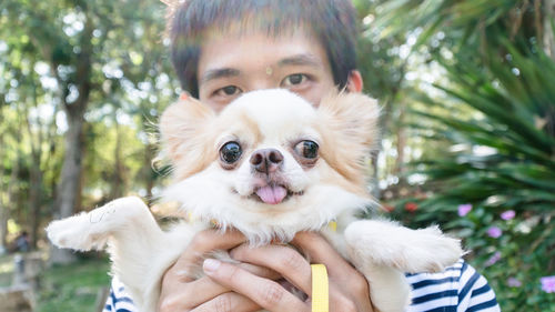 Portrait of young man with dog