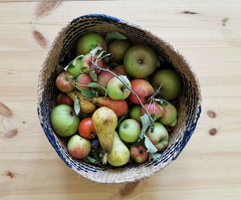 High angle view of apples in basket on table