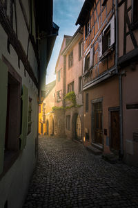 Narrow alley amidst buildings in town