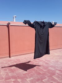 Clothes drying against clear sky