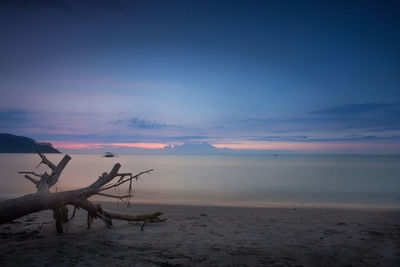 Scenic view of sea against sky at sunset