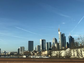 Modern buildings in city against sky