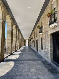 Empty corridor along buildings