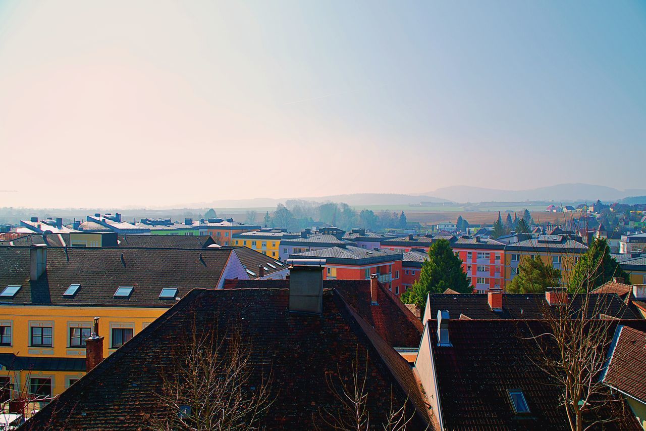 HIGH ANGLE VIEW OF BUILDINGS AGAINST SKY