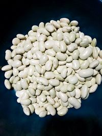 High angle view of white candies against black background