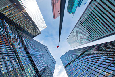 Low angle view of modern buildings against sky