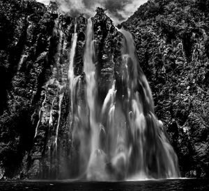 Scenic view of waterfall in forest