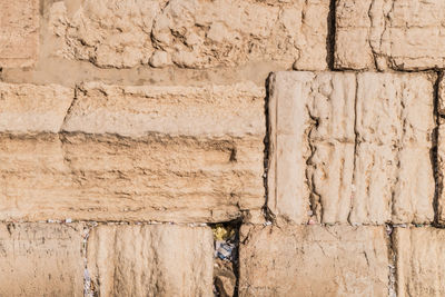 The western wall or wailing wall is the holiest place to judaism in the old city of jerusalem.