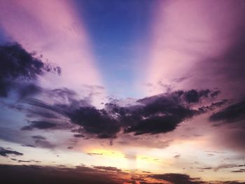 Low angle view of dramatic sky during sunset