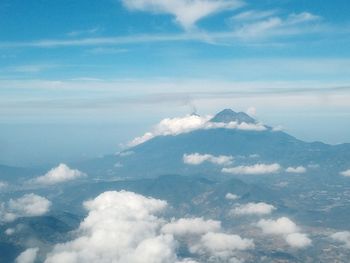 Aerial view of clouds over mountain