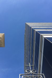 Low angle view of building against clear blue sky