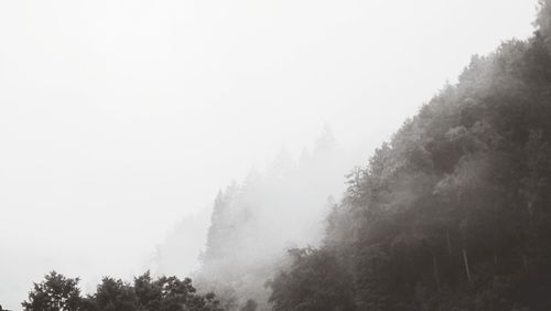 Scenic view of mountains in foggy weather