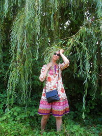 Full length of young woman standing on land