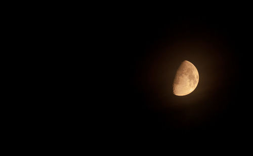 Low angle view of moon against sky at night