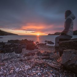 Scenic view of sea against sky at sunset