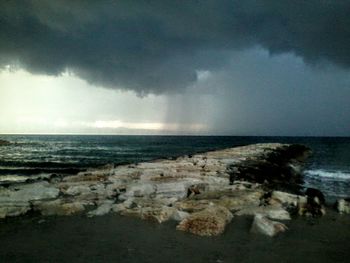 Scenic view of sea against cloudy sky