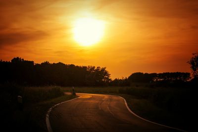 Road passing through field