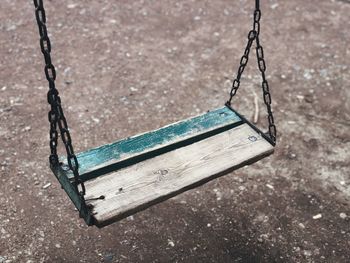High angle view of empty swing hanging at playground