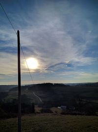 Low angle view of electricity pylon against sky