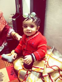 Cute boy sitting at home