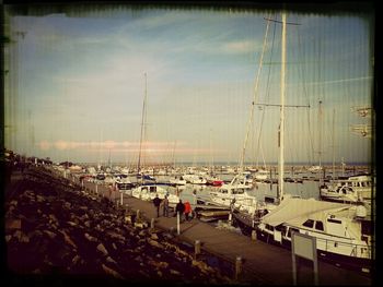 Boats moored at harbor