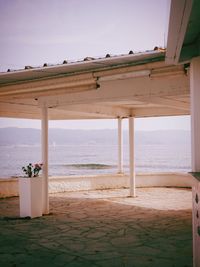 Lifeguard hut on beach against sky