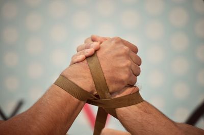 Close-up of man holding hands