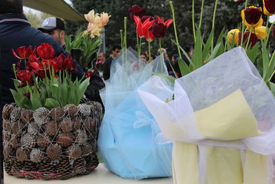 Close-up of flowering plants in basket for sale