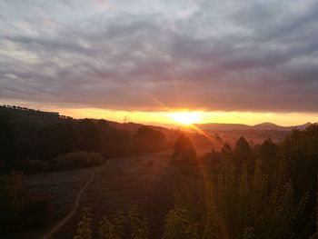 Scenic view of landscape against sky during sunset