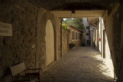 Perspective of a narrow medieval alley in scarlino