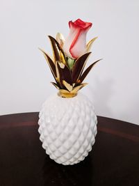 Close-up of white rose on table