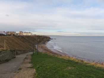 Scenic view of beach against sky