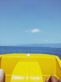 Yellow blue sea against sky